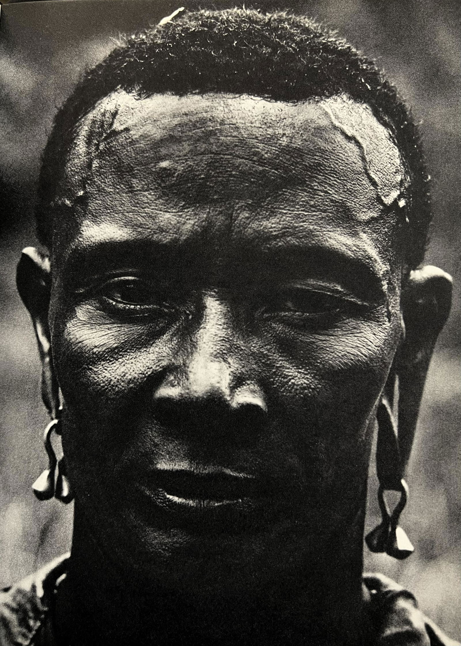 Peter Hill Beard, Larsili, The Wandorobo-Masai Hunting Genius, 1960s: Photographer: Peter Hill Beard (January 22, 1938 â€“ March 31 / April 19, 2020) was an American artist, photographer, diarist, and writer who lived and worked in New York City, Montauk and Kenya.