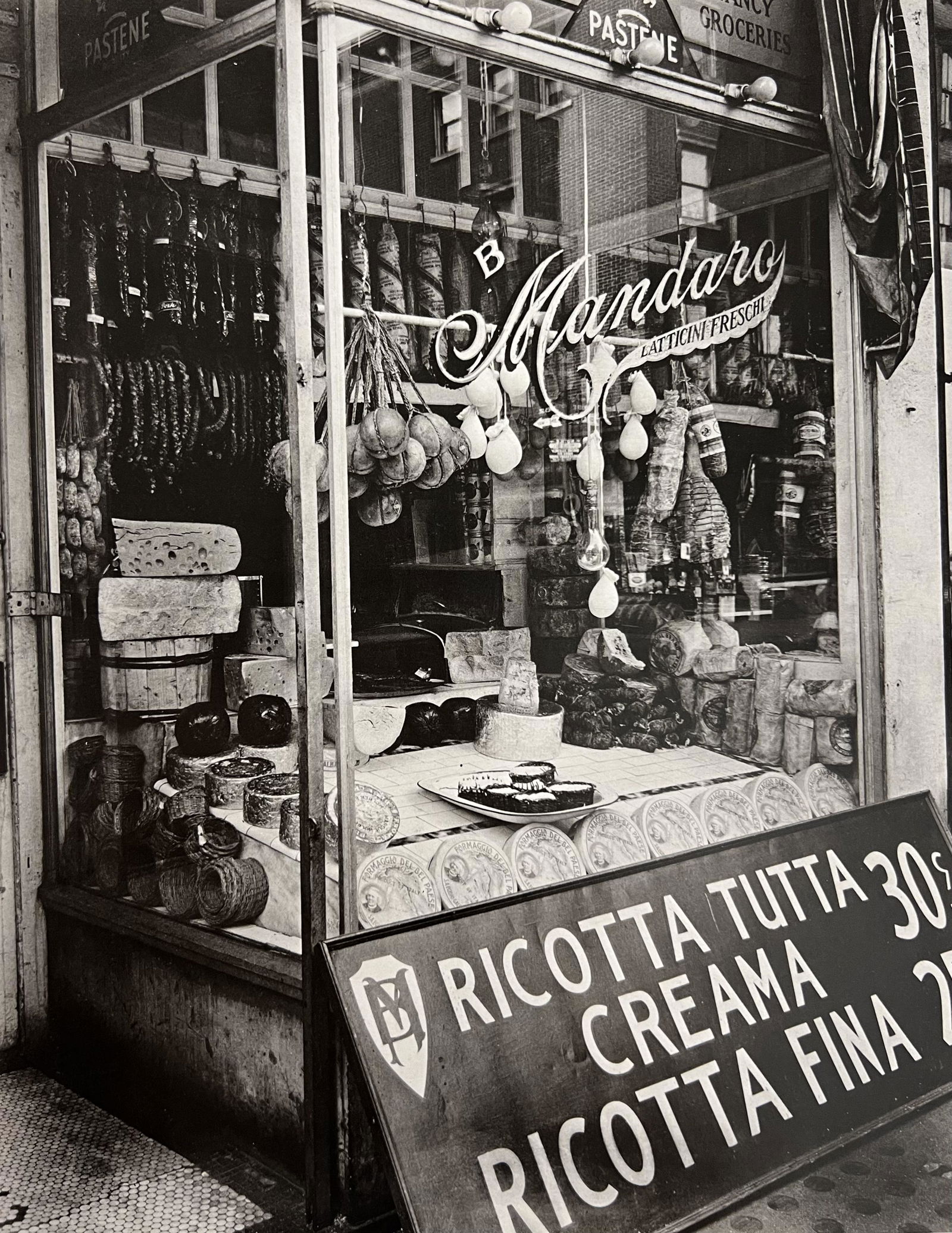 Berenice Abbott, Cheese Store, 276 Bleecker Street, 1930s: Photographer: Berenice Alice Abbott was an American photographer best known for her portraits of between-the-wars 20th century cultural figures, New York City photographs of architecture and urban des