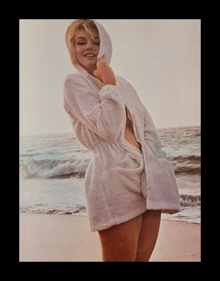Marilyn Monroe in a robe at the beach: Photographer: George Barris Subject/Title: Marilyn Monroe in a robe at the beach Date Of Negative: Undated Type Of Print: Authentic Vintage Sheet Fed Photogravure/Heliogravure Date Of Print: 2000 Publ