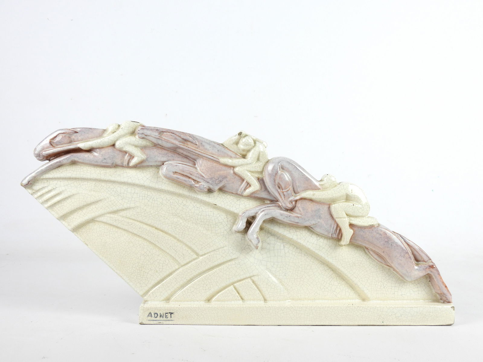 Jacques ADNET (1900 - 1984) & Jean ADNET (1900 - 1995) pour La MaÃ®trise "Les Coureurs" Circa: Jacques ADNET (1900 - 1984) & Jean ADNET (1900 - 1995) pour La MaÃ®trise"Les Coureurs"Circa 1928-1929Sculpture en faÃ¯ence Ã©maillÃ©e blanc craquelÃ© Ã rehauts de violet nuancÃ© sur les