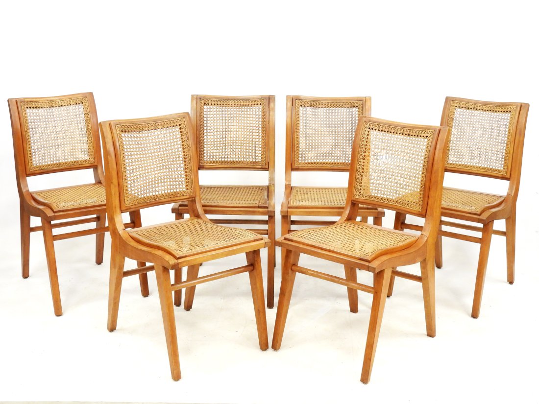 Louis SOGNOT (1892-1969): Rare suite de six chaises en bois, le dossier et l'assise Ã fond de: Louis SOGNOT (1892-1969): Rare suite de six chaises en bois, le dossier et l'assise Ã fond de canne. AnnÃ©es 1950. 87 x 44 x 45 cm (accident au cannage d'un dossier)
