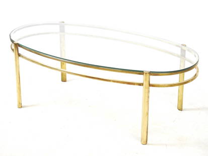 Jacques QUINET (1918-1992) pour la maison Malabert : Table basse a plateau en verre transparent,: Jacques QUINET (1918-1992) pour la maison Malabert : Table basse a plateau en verre transparent, pietement en bronze a double ceinture entre quatre pieds. Signe. NÂ° et annote Broncz. H 36 - L 100 -