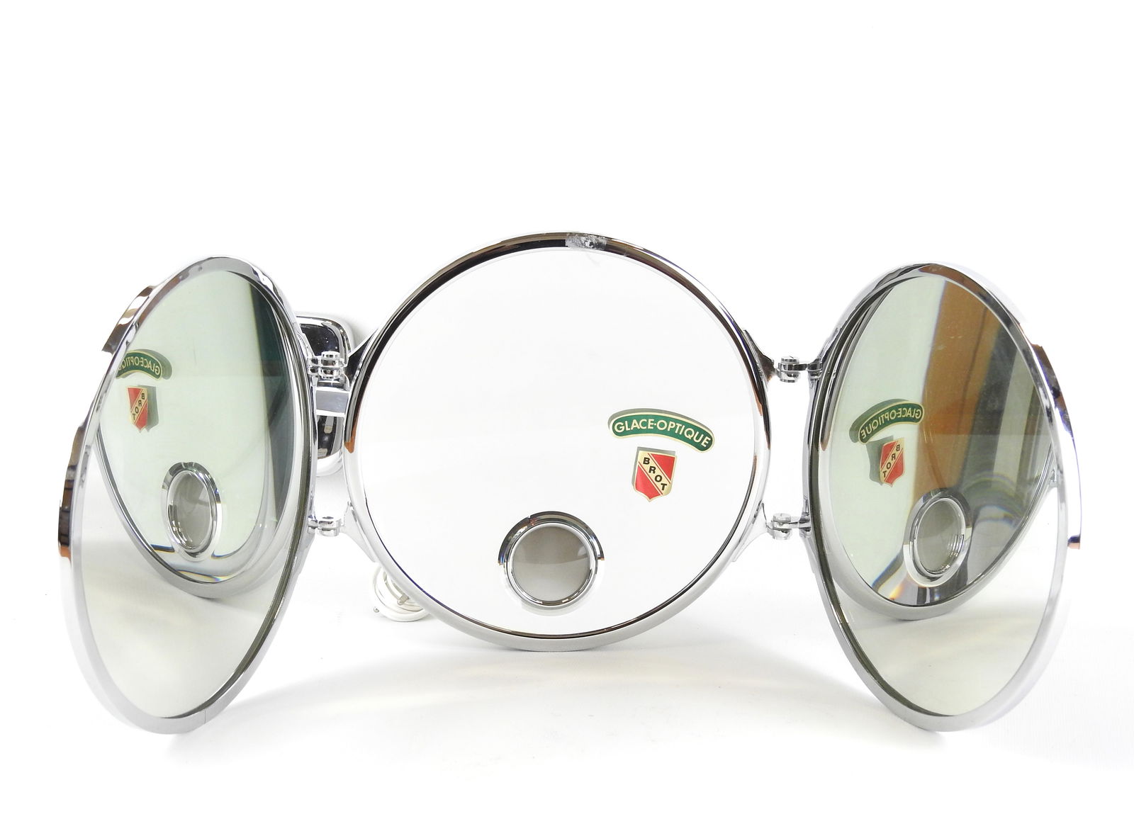 BROT : Miroir triptyque mural avec glace optique. Etiquette et marque a la base. Diam. 24 cm.: BROT : Miroir triptyque mural avec glace optique. Etiquette et marque a la base. Diam. 24 cm.