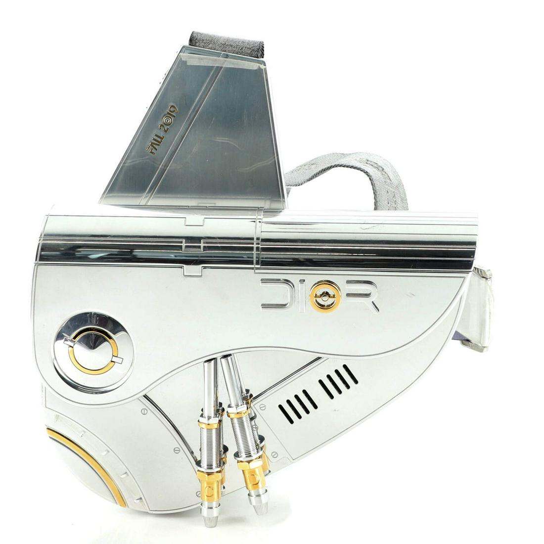 Christian Dior Sorayama Saddle Crossbody Bag Metal: Christian Dior Sorayama Saddle Crossbody Bag Metal Exterior Color: Silver Interior Color: Black Exterior Material: Metal Interior Material: Leather Hardware Color: Gold, Silver Accessories: Box, G