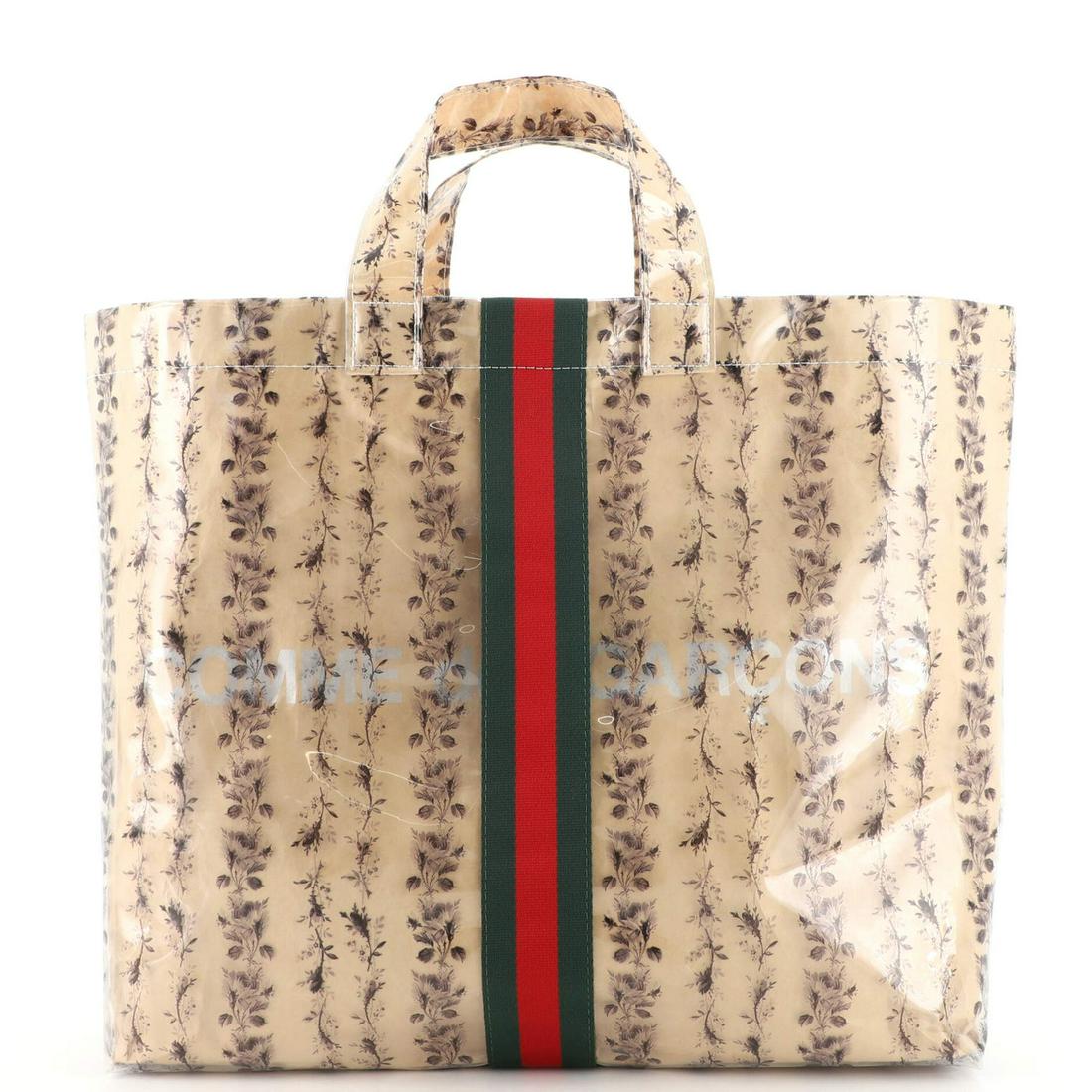 Gucci Comme de Garcons Web Shopping Tote Printed PVC and Paper Medium: Gucci Comme de Garcons Web Shopping Tote Printed PVC and Paper Medium Exterior Color: Brown, Clear Interior Color: Neutral Exterior Material: Pvc Interior Material: Fabric Accessories: Box RBJ no: