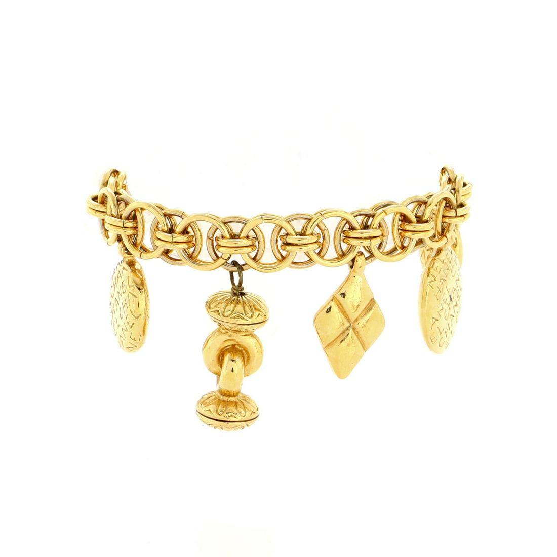 Chanel Vintage Charm Chain Bracelet Necklace Metal: Chanel Vintage Charm Chain Bracelet Necklace Metal Exterior Color: Gold Material: Metal Item No: 198143/51 SIZE AND FIT: Length: 6.75 ", Width: 1.5 " Scratches, discoloration and tarnish throughout.