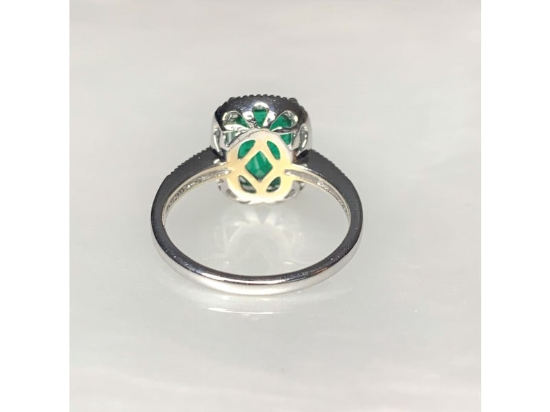 14K White Gold Emerald Cut Emerald Diamond Ring: 14K White Gold Emerald Cut Emerald Diamond Ring Product Code: 14KWHITEGO-62017B617ABA0 Condition: Never Worn A graceful and timeless emerald ring featuring a vibrant deep green emerald cut center ston
