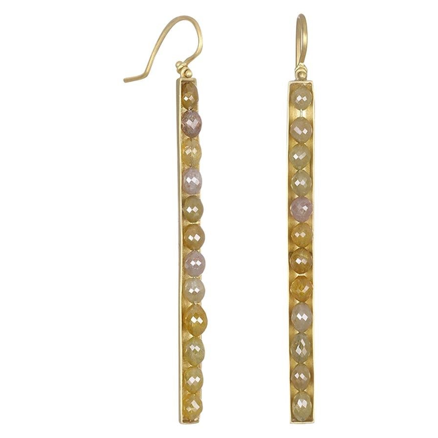 Faye Kim 18 Karat Gold Oval Yellow Raw Diamond Bar Earrings: Faye Kim 18 Karat Gold Oval Yellow Raw Diamond Bar Earrings Metal: Gold, 18k Gold Stone: Diamond, Yellow Diamond Stone Cut: Oval Cut Weight: 9.24 ct Dimensions: Length: 2 in (50.8 mm) Style: Moder