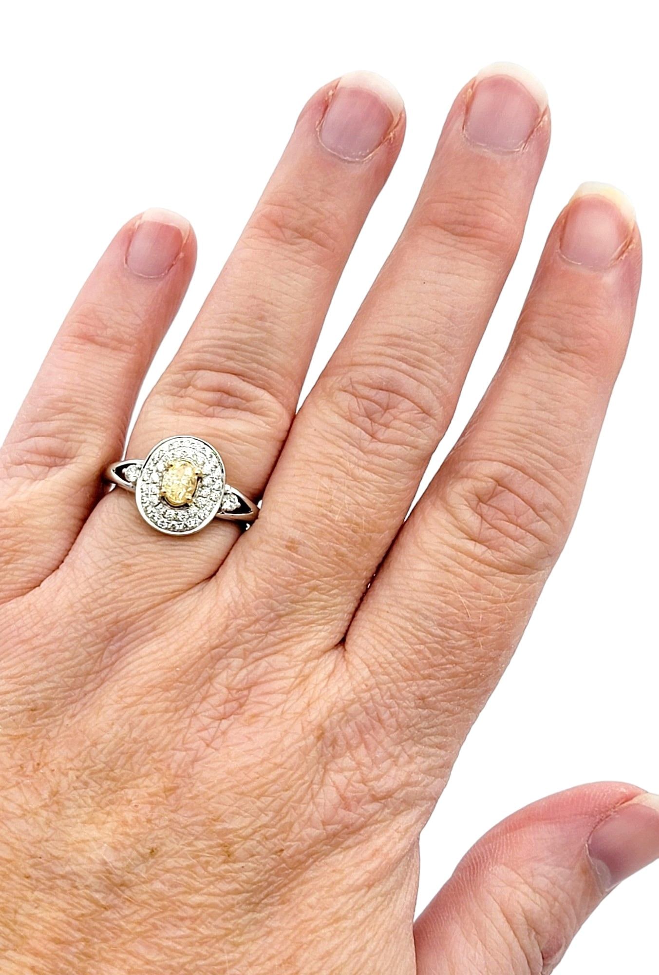 Oval Fancy Yellow Diamond with White Diamond Double Halo Set in White Gold: Oval Fancy Yellow Diamond with White Diamond Double Halo Set in White Gold Ring Size: 7.25 US, Not Resizable Metal: Yellow Gold, White Gold, 14k Gold, Gold Stone: Yellow Diamond, White Diamond Stone C