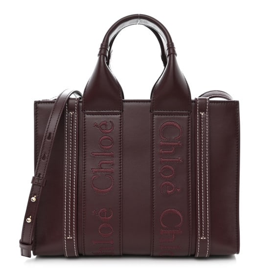 Chloe Calfskin Small Woody Tote: Chloe Calfskin Small Woody Tote Deep Violine SKU no: RBJ1371442 Brand: CHLOE Condition: Excellent Condition Details: Exterior: Creases Base length: 10 in Height: 8 in Width: 3.5 in Drop: