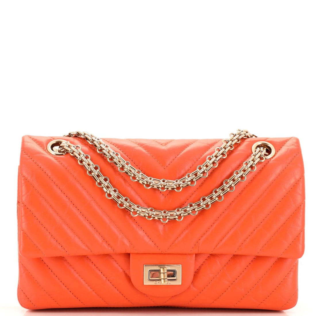 Chanel Reissue 2.55 Flap Bag: Chanel Reissue 2.55 Flap Bag Chevron Aged Calfskin 225 Exterior Color: Orange Interior Color: Orange Exterior Material: Leather Interior Material: Leather Hardware Color: Gold Tone Estimated Retai