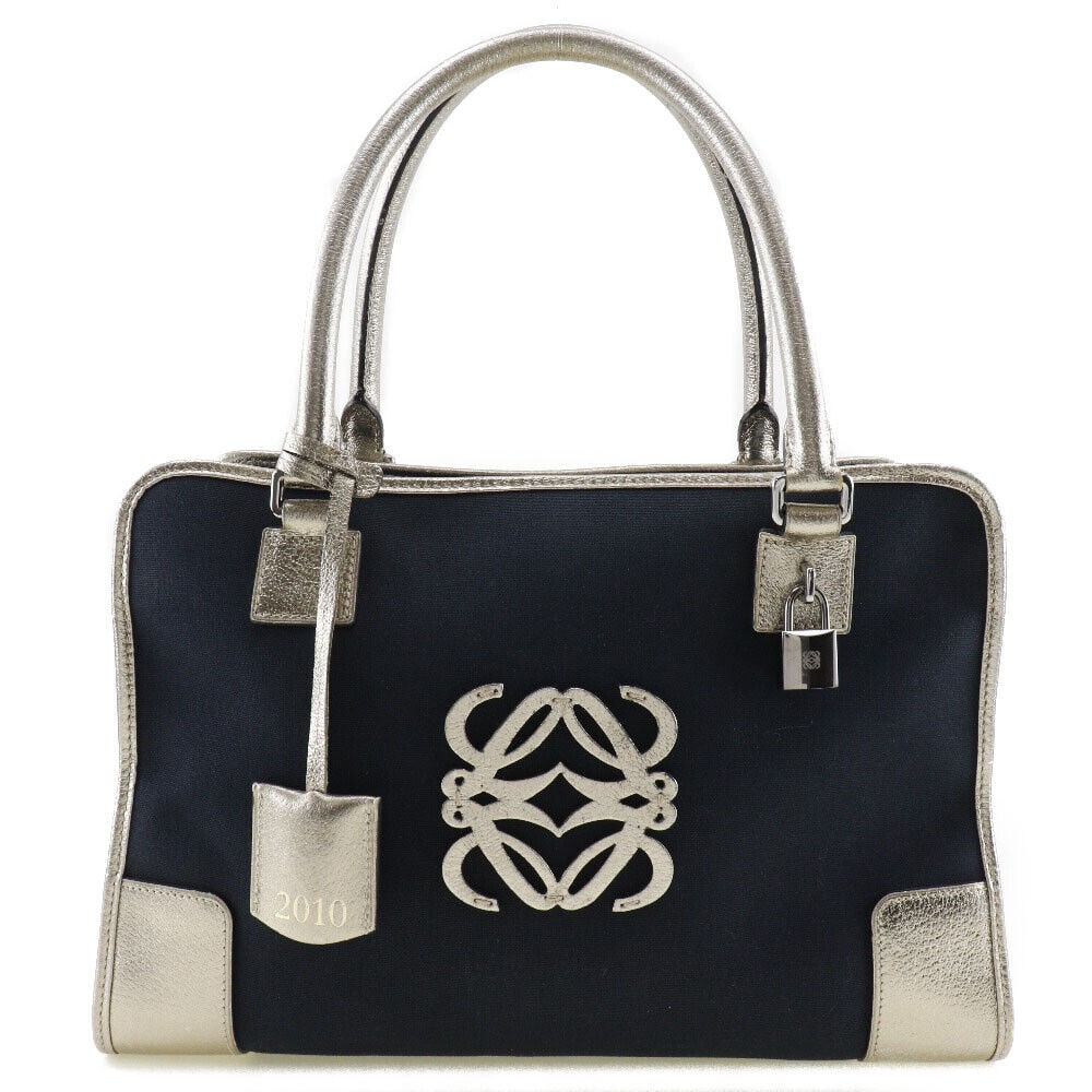 LOEWE Amazona 36 Handbag Boston bag: LOEWE Amazona 36 Handbag Boston bag 2010 Navy blue/Silver canvas/leather Women Condition: Pre-owned Seller Notes: ?Fair+ : Pre-Owned with some noticeable scratches and/or stains. I151523128? Brand: LO