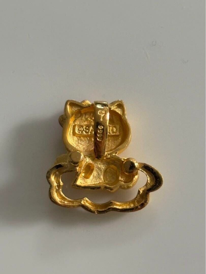 Hello Kitty Sanrio Necklace Top Pure: Hello Kitty Sanrio Necklace Top Pure Gold K24 Used Very Rare Condition: Used Important Notes: ?Weight: 4.14 g of pure gold Size: approx. 1 cm x 1 cm No noticeable stains or scratches? Convention/Event