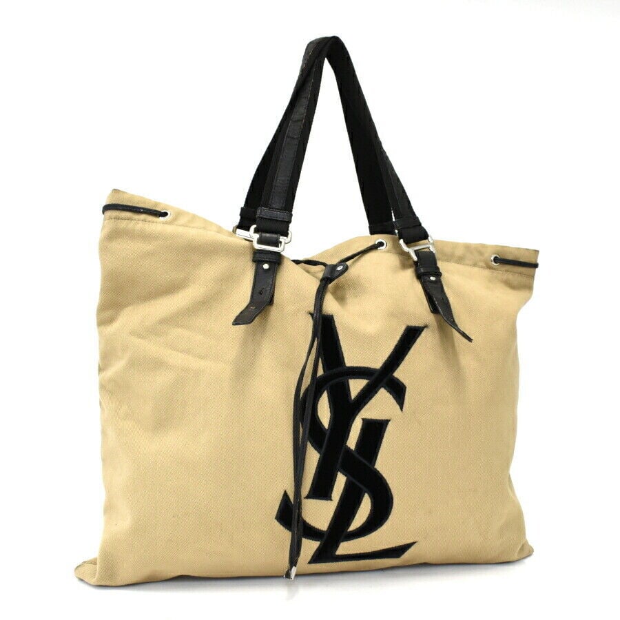 Yves Saint Laurent/Tote bag/Kahala/Canvas/Beige x Black: Yves Saint Laurent/Tote bag/Kahala/Canvas/Beige x Black 241205N Condition: Pre-owned Handle/Strap Color: Beige Hardware Color: Beige Exterior Material: Leather Brand: Saint Laurent Department: Lad