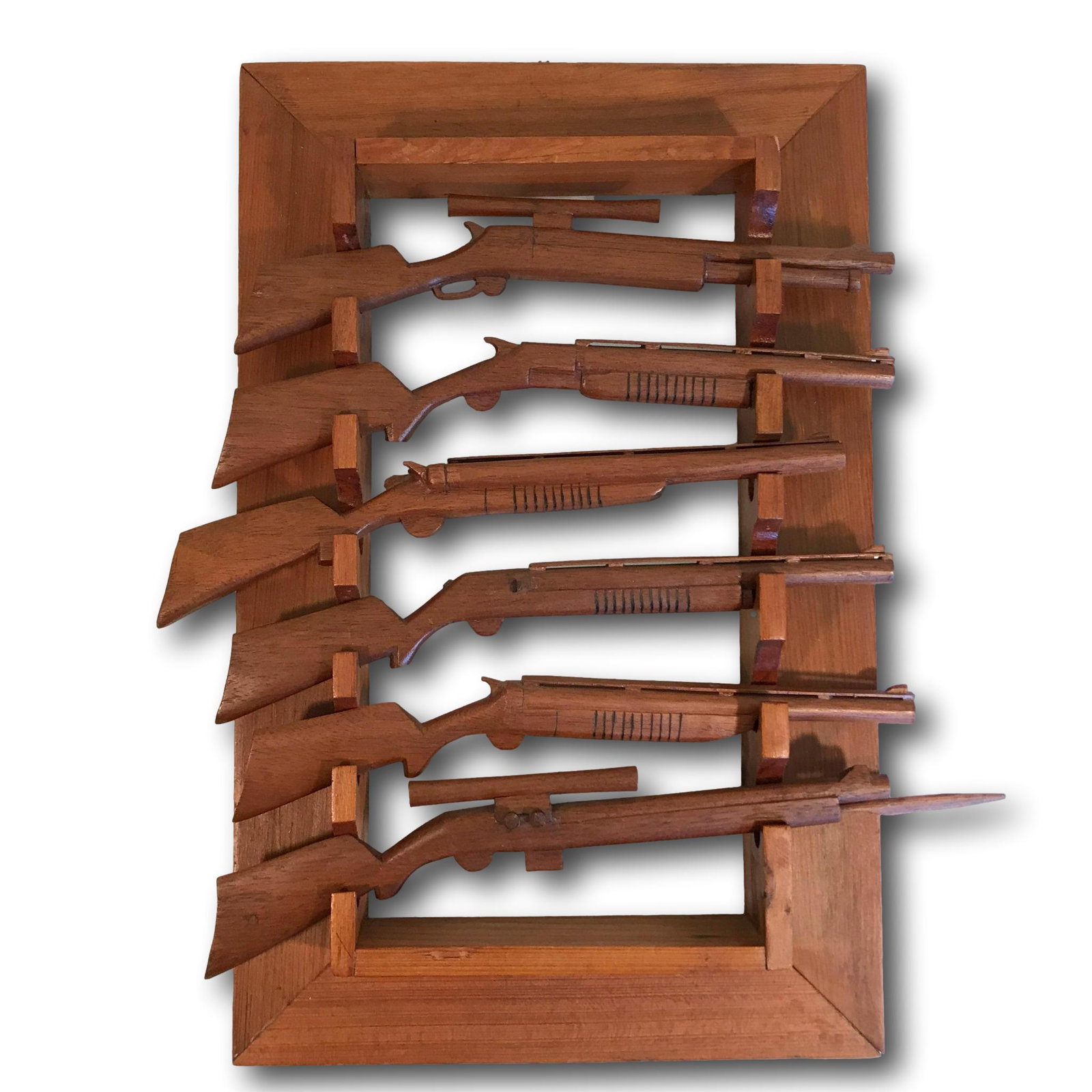 Hand Carved Guns and Gun Rack Display: Piece measures 14 1/2"L x 9 1/4"W.
