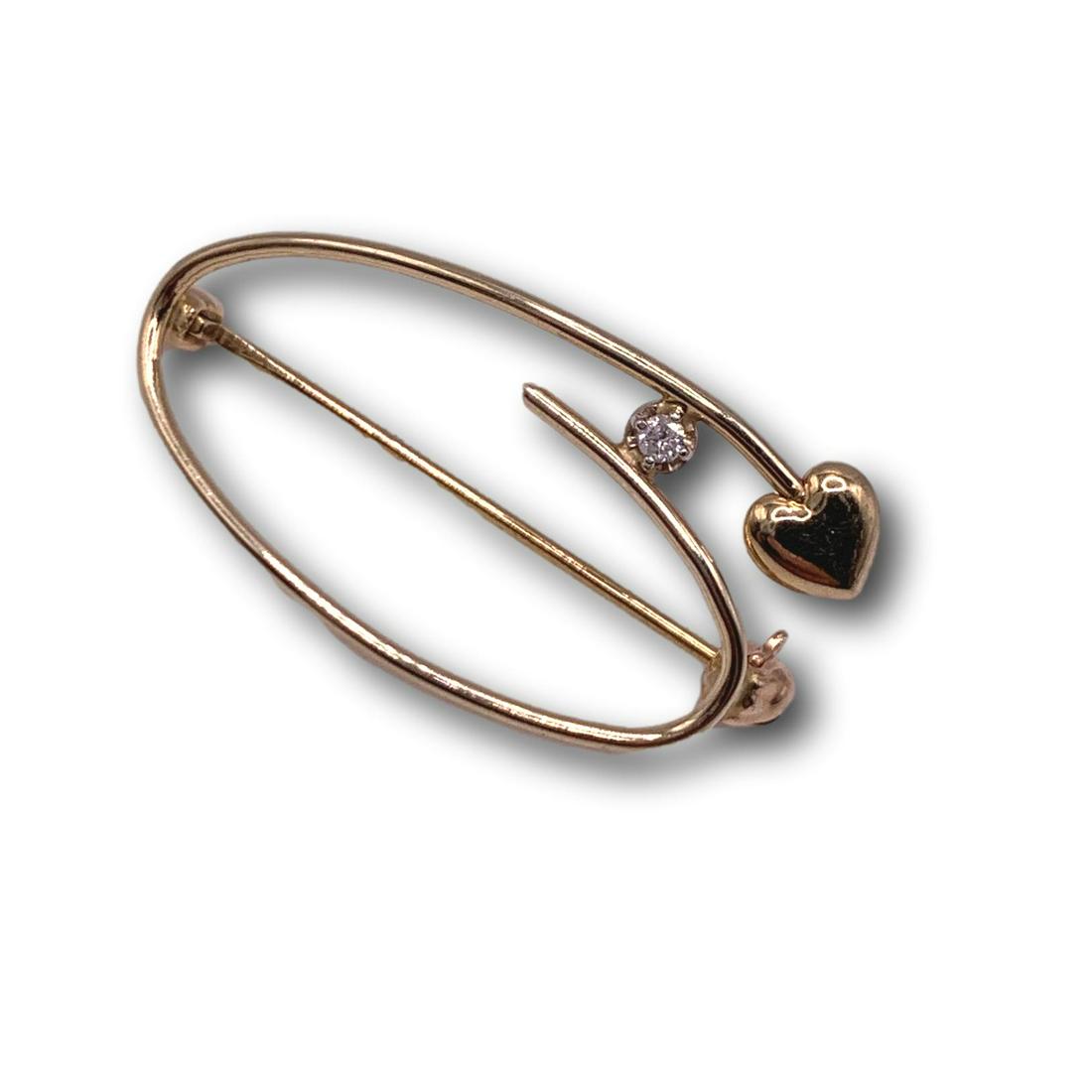 14K Gold Heart Pin with a Tiny Diamond: Total weight 1.3 grams. This item is available for local pickup in Glenview, IL, or via shipment through LiveShipping. International bidders: Shipping will be added to your invoice. Meadow Lane Auctio