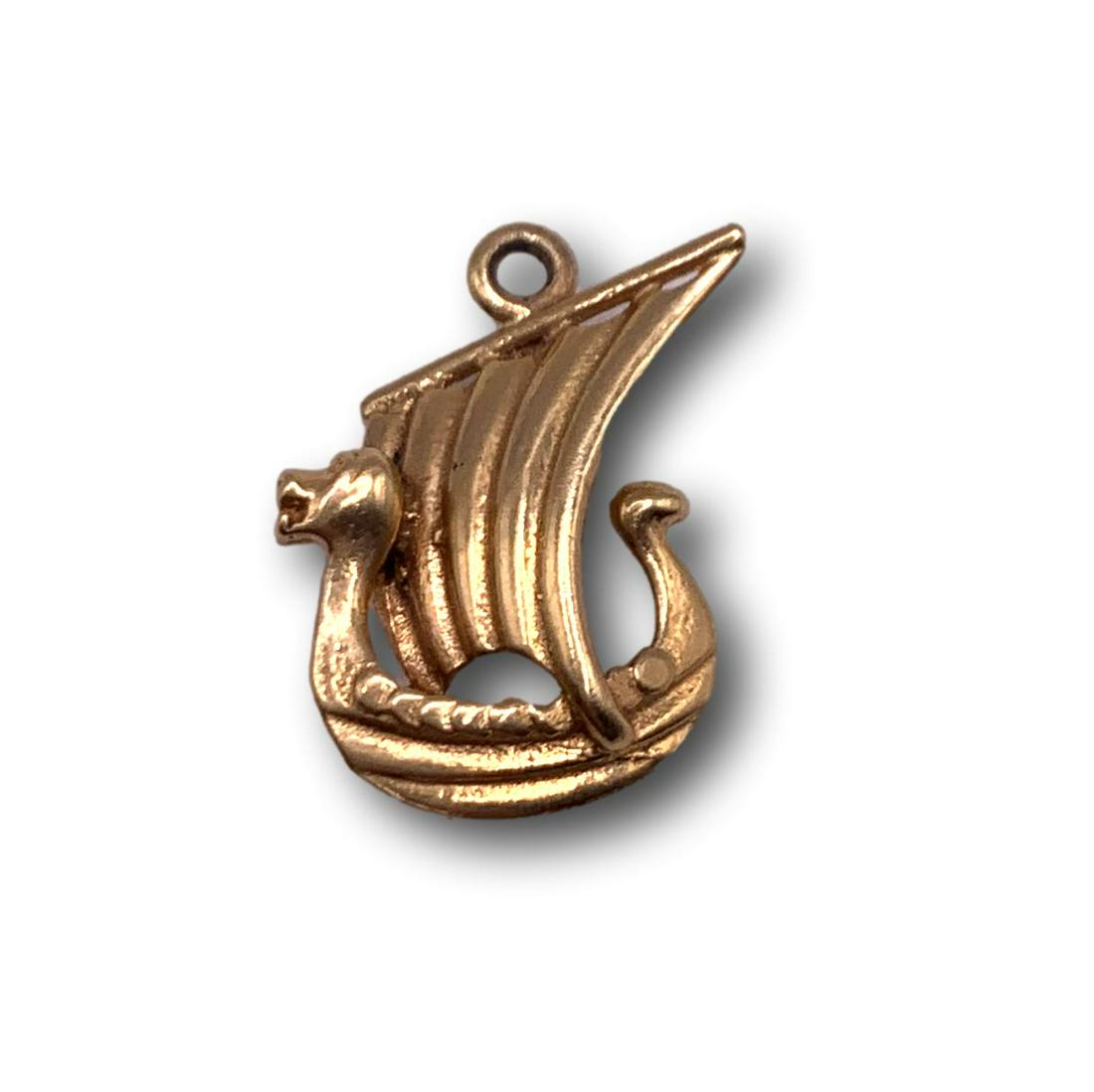 14K Gold Viking Ship Charm Pendant: Total weight 1.1 grams. Charm is unmarked but tested to be 14K gold. Measures 5/8"H x 1/2". This item is available for local pickup in Glenview, IL, or via shipment through LiveShipping. International