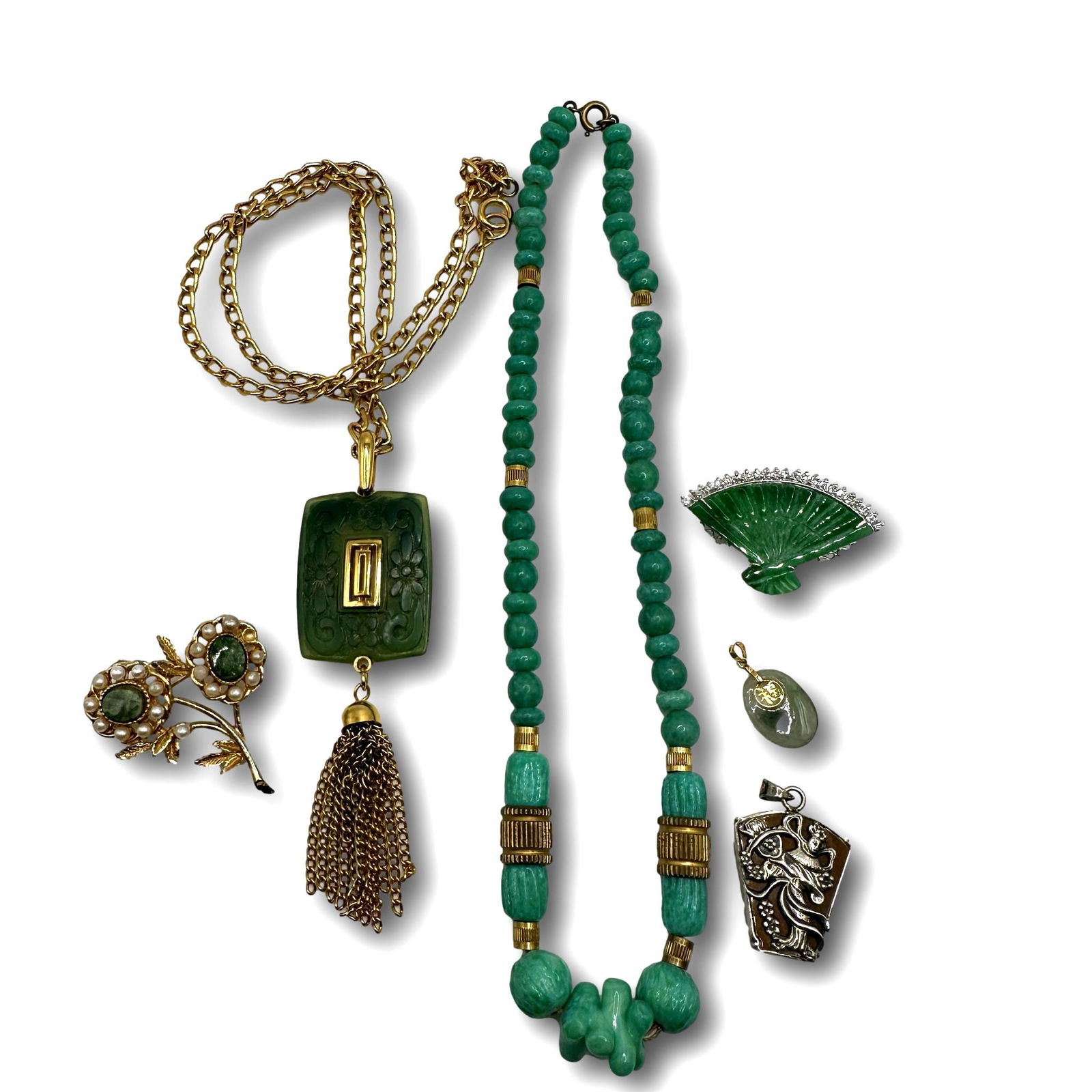 Trifari Jade-Like Tassel Necklace With Nice Vintage Complimenting Pieces: Tassel necklace measures 20" in length. Green beaded necklace measures 16". PICKUP AND SHIPPING Local pickup is available in Glenview, IL by appointment. The address will be provided on your invoice a