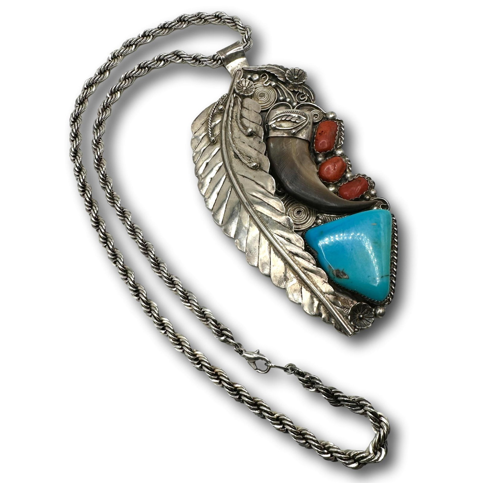 Sterling Silver Turquoise, Coral and Bear Claw Pendant: Chain is not sterling and measures 23" from end to end. Pendant measures 5 3/4"L x 3"W. Signed "Lil Beaver". PICKUP AND SHIPPING Local pickup is available in Glenview, IL by appointment. The address w