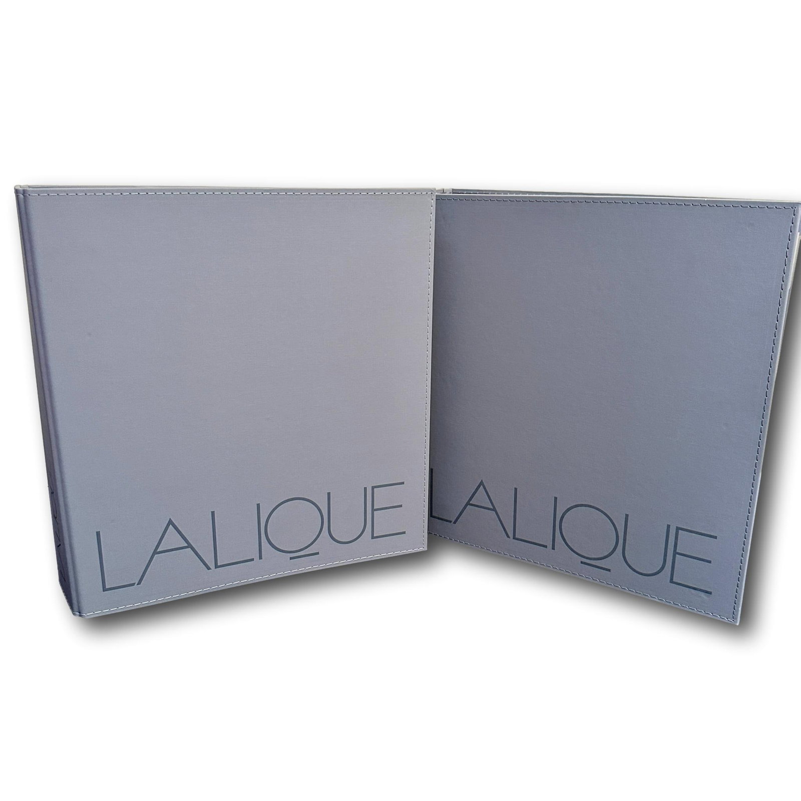 Pair of Lalique Salesman Catalogs: In good condition. PICKUP AND SHIPPING: Local pickup is available in Glenview, IL by appointment. The address will be provided on your invoice at checkout. In-House shipping is available for this lot 