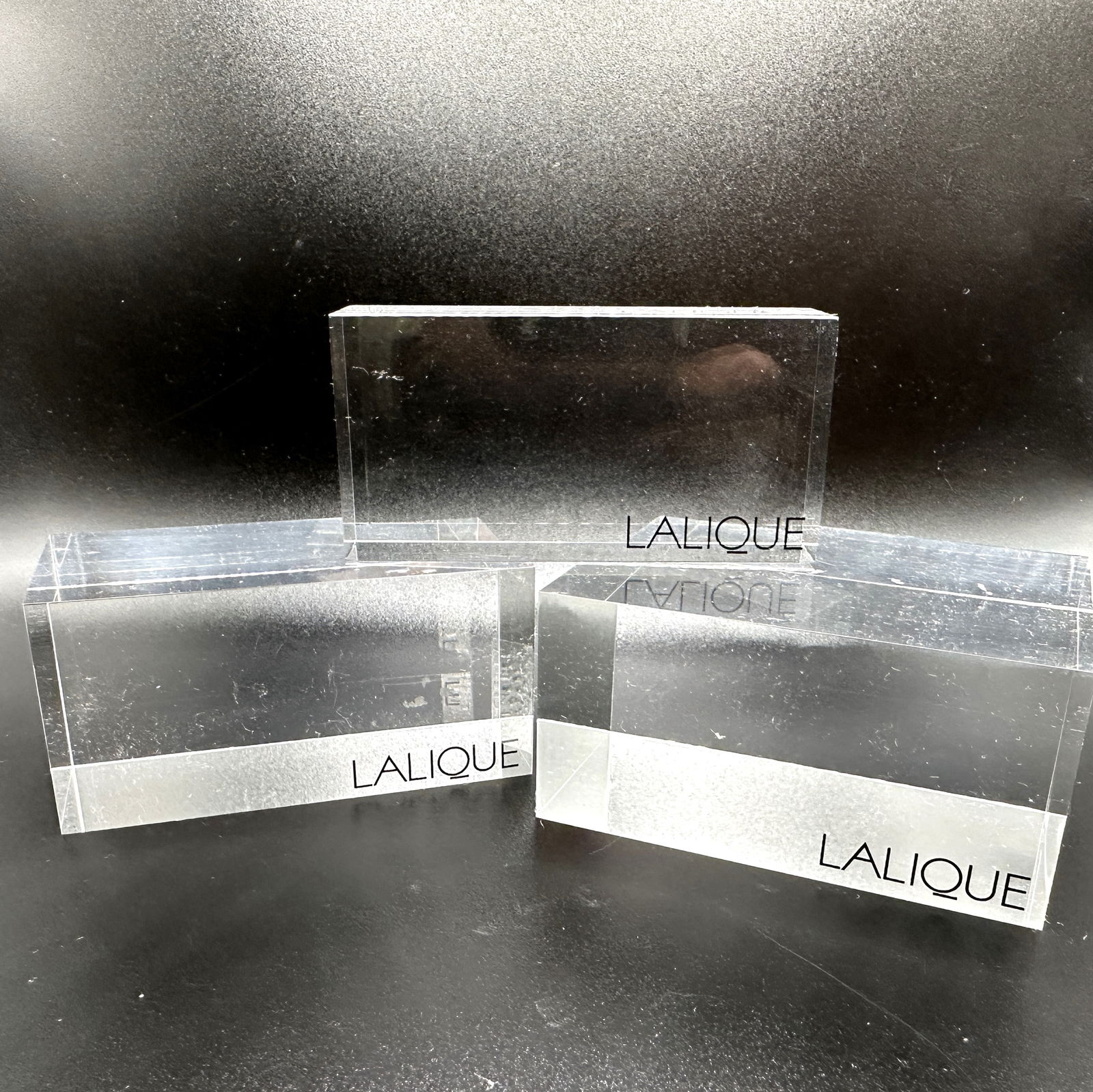 Lalique Lucite Display Pieces: Each measures 3" wide. Some surface wear and rough areas. Most items are used or vintage and may show wear commensurate with age and use. Please inspect photos carefully as they are a part of the desc