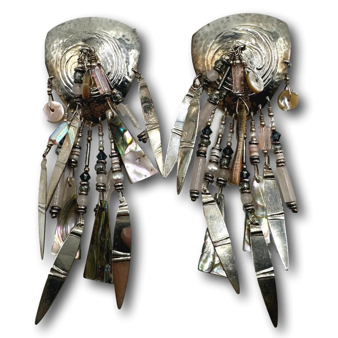 Vintage Chandelier Sterling Silver Tabra Earrings: Each measures 4 1/4" in length. Sterling silver Tabra earrings are sure to make a statement. They are a unique and beautiful way to add a touch of Navajo flair to your outfit.