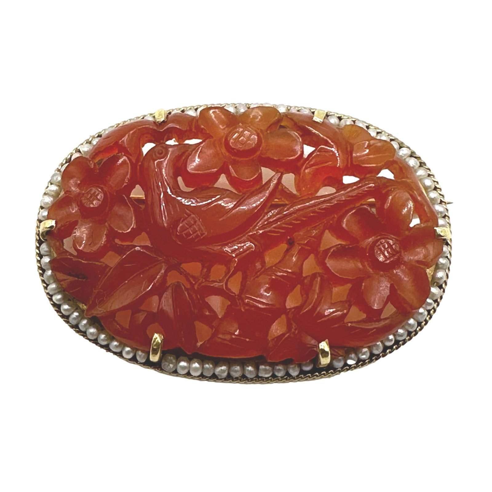 Vintage Carved Amber Brooch with 14K and Pearl Mounting: Measures 1 5/8" x 1 1/8". Weighs 10.4 grams. Tiny pearls and a 14k gold rope frame surround the intricately carved amber centerpiece. A lovely addition to your vintage jewelry collection.