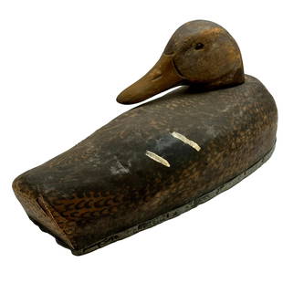 Antique Canvas and Wooden Duck Decoy: Measures 10 1/2"L x 5 1/2"H x 4 1/2"D approximately. Please note lots may show signs of wear commensurate with age and use, and the lack of a statement regarding condition does not imply the lot is in