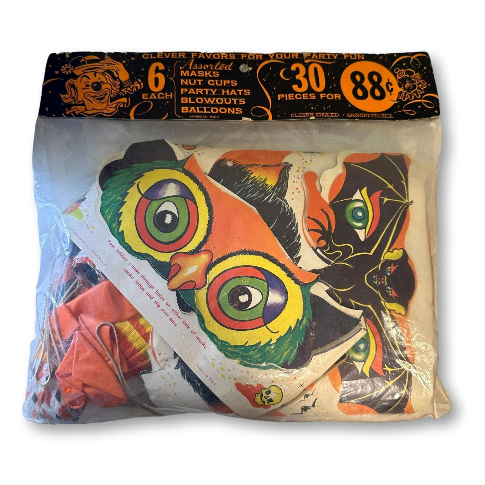 Unopened Bag of Halloween Party Favors: Low Estimate $50 - High Estimate $100. Bag shows signs of wear and several tears. Bag measures approximately 11 1/2" x 10 3/4". All lots in this auction come from a lifetime of collecting Halloween an