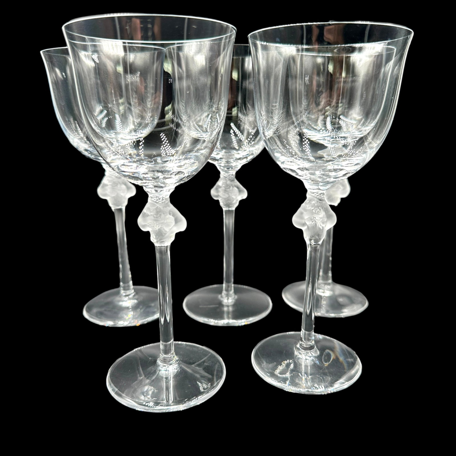 Lot of 5 Lalique Roxane Goblets: No chips or cracks. Refer to photos for additional condition information as they are a part of the description. Please note lots may show signs of wear commensurate with age and use, and the lack of a