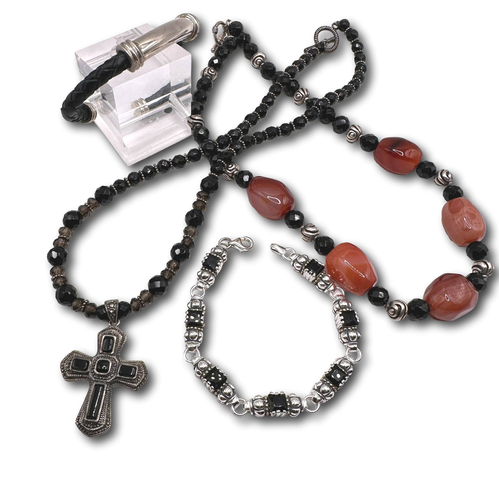 Lot of Sterling Silver Fashion Jewelry: Bracelet measures 7 1/2" long. Cross necklace measures 17" long. Black crystal and agate necklace measures 16" in length. All are in excellent condition with no visible wear. Refer to photos for addit