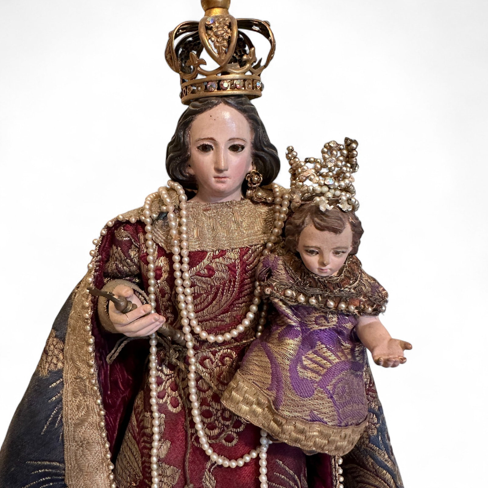 Antique Blessed Mother and Jesus Ornate Figurine: Beautiful figurine with great detail. Measures 17" tall. Missing left earring. Crown is unattached from Jesus' head and needs to be re-fastened. Otherwise in very nice condition. Refer to photos for a