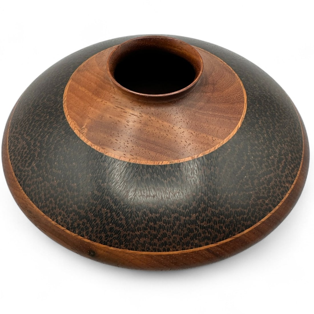 Galen Carpenter Exotic Wood Hand Crafted Vase: Measures 3 1/2'H x 8 1/2" diameter, approximately. Consists of African Padouk, and Panamanian Blak Palm woods. Refer to photos for additional condition information as they are a part of the descriptio