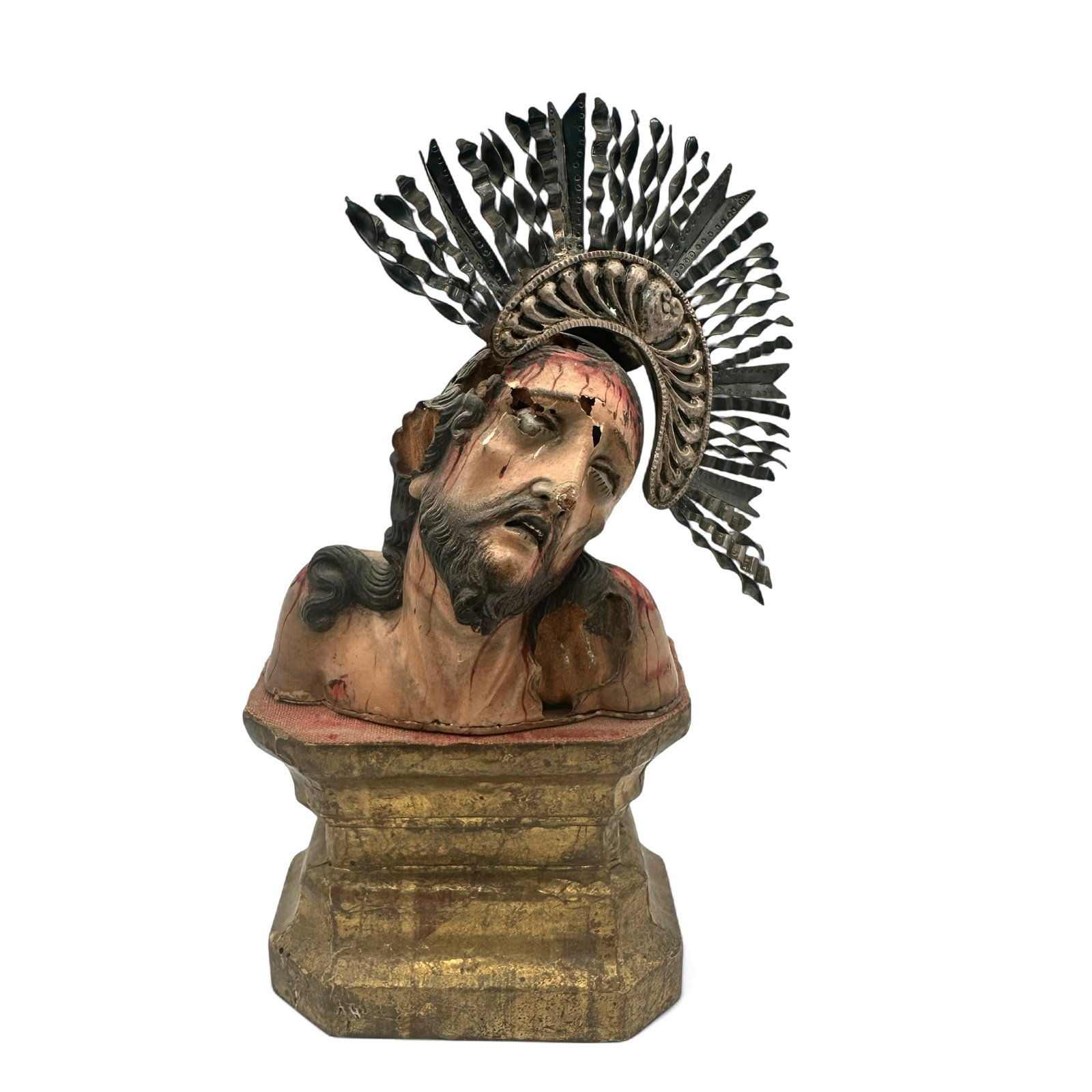 Antique Carved and Painted Wooden Bust of Christ: Expressive hand-carved wooden bust depicting Christ crowned with thorns, wearing an ornate metal halo of radiating rays. Finely modeled features capture a moment of anguish and devotion, enhanced by t
