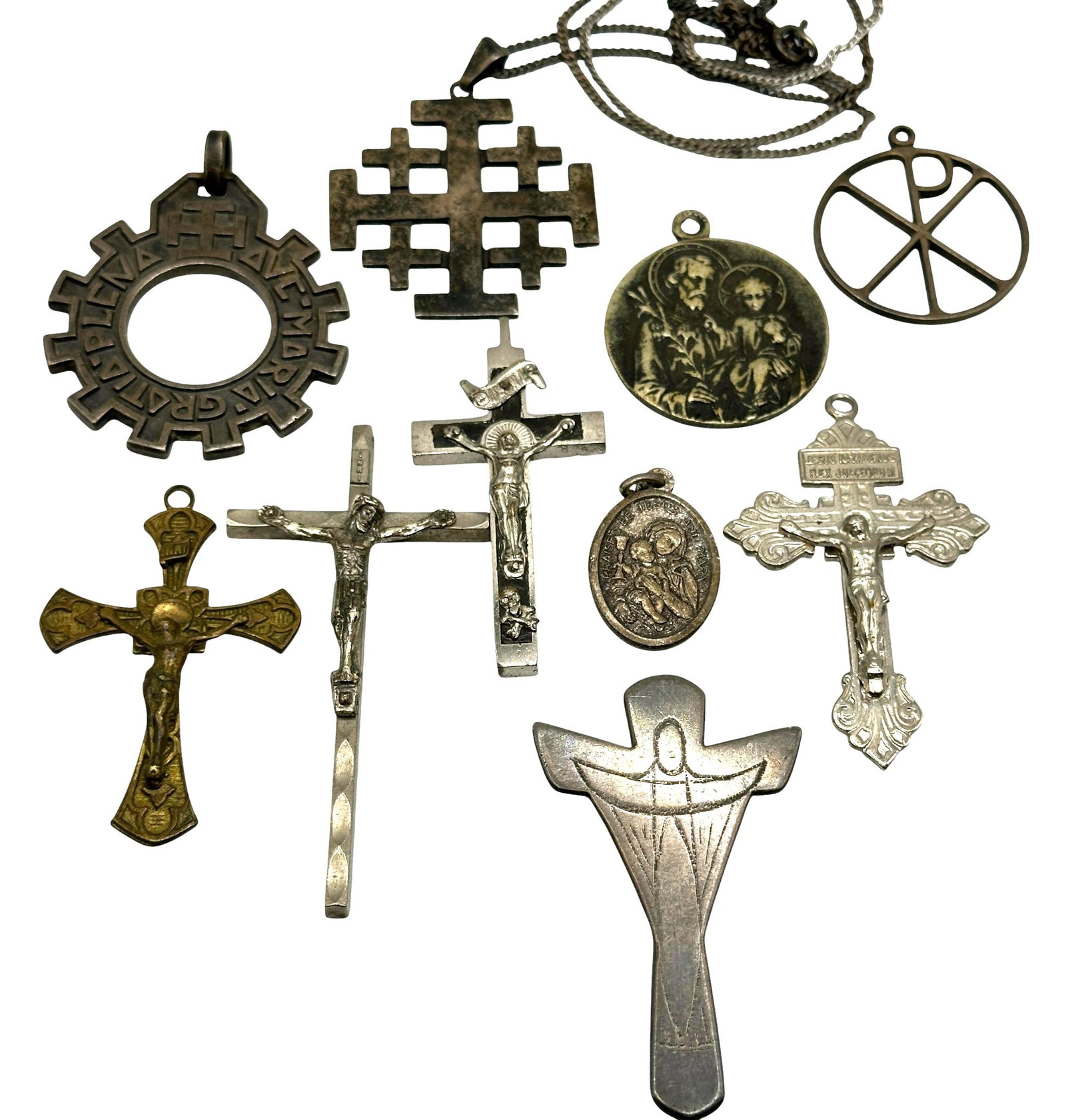Collection of Crucifixes and Religious Pendants: Refer to photos for additional condition information as they are a part of the description. Please note lots may show signs of wear commensurate with age and use, and the lack of a statement regarding