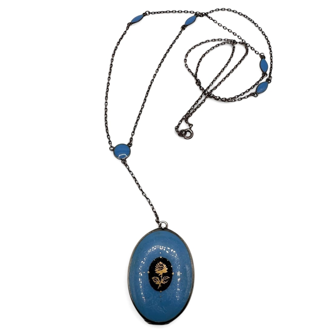 Antique Blue Enamel and Sterling Silver Pendant on Chain: Chain measures 24" from end to end. Pendant measures 1 1/4" high. Refer to photos for additional condition information as they are a part of the description. Please note lots may show signs of wear co