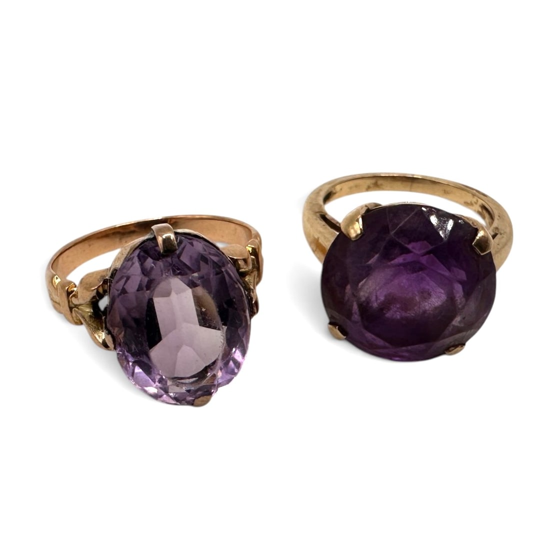 Pair of 9K Gold Vintage Amethyst Rings: Both ring sizes approximately 4 3/4. Total weight 8.6 grams. Stones show heavy wear. Refer to photos for additional condition information as they are a part of the description. Please note lots may sh