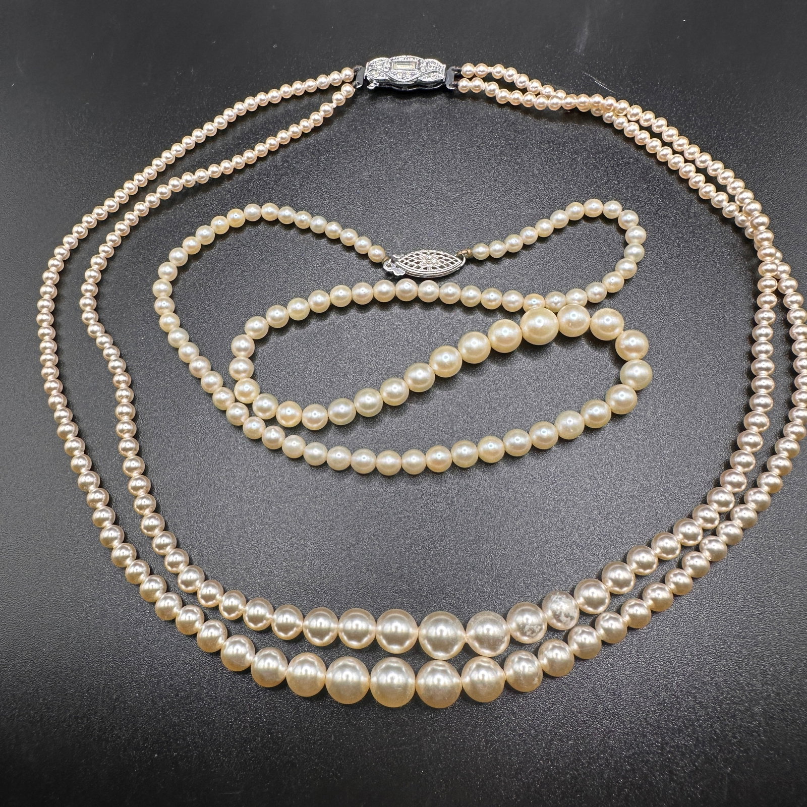 Pair of Vintage Faux Pearl Necklaces: Each measures 16" from end to end. Refer to photos for additional condition information as they are a part of the description. Please note lots may show signs of wear commensurate with age and use,