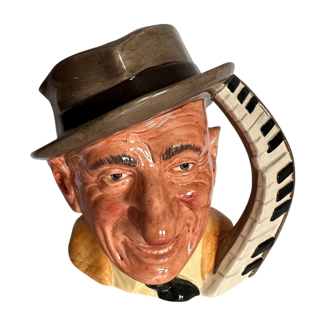 Jimmy Durante Royal Doulton Celebrity Collection Toby Jug: Measures 8" tall. Refer to photos for additional condition information as they are a part of the description. Please note lots may show signs of wear commensurate with age and use, and the lack of a s