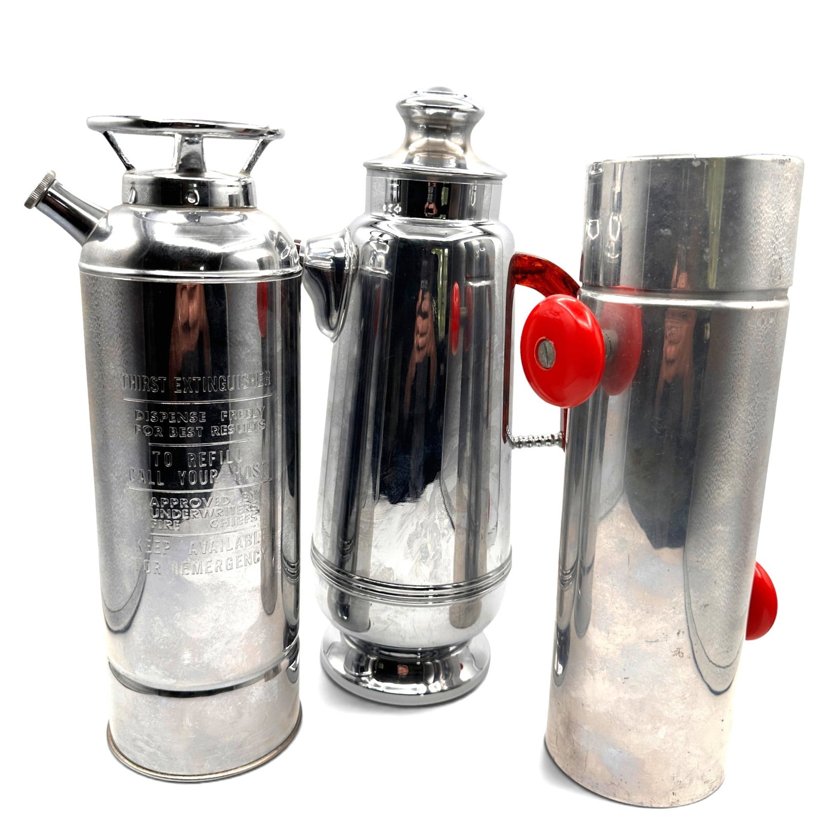 Lot of Vintage Martini Shakers including Musical Fire Extinguisher: Musical martini shaker fashioned after a fire extinguisher plays "How Dry I Am". 1930's Art Deco red-handled "Konga" mixer is used by turning the knobs simultaneously. Each measure approximately 11" t