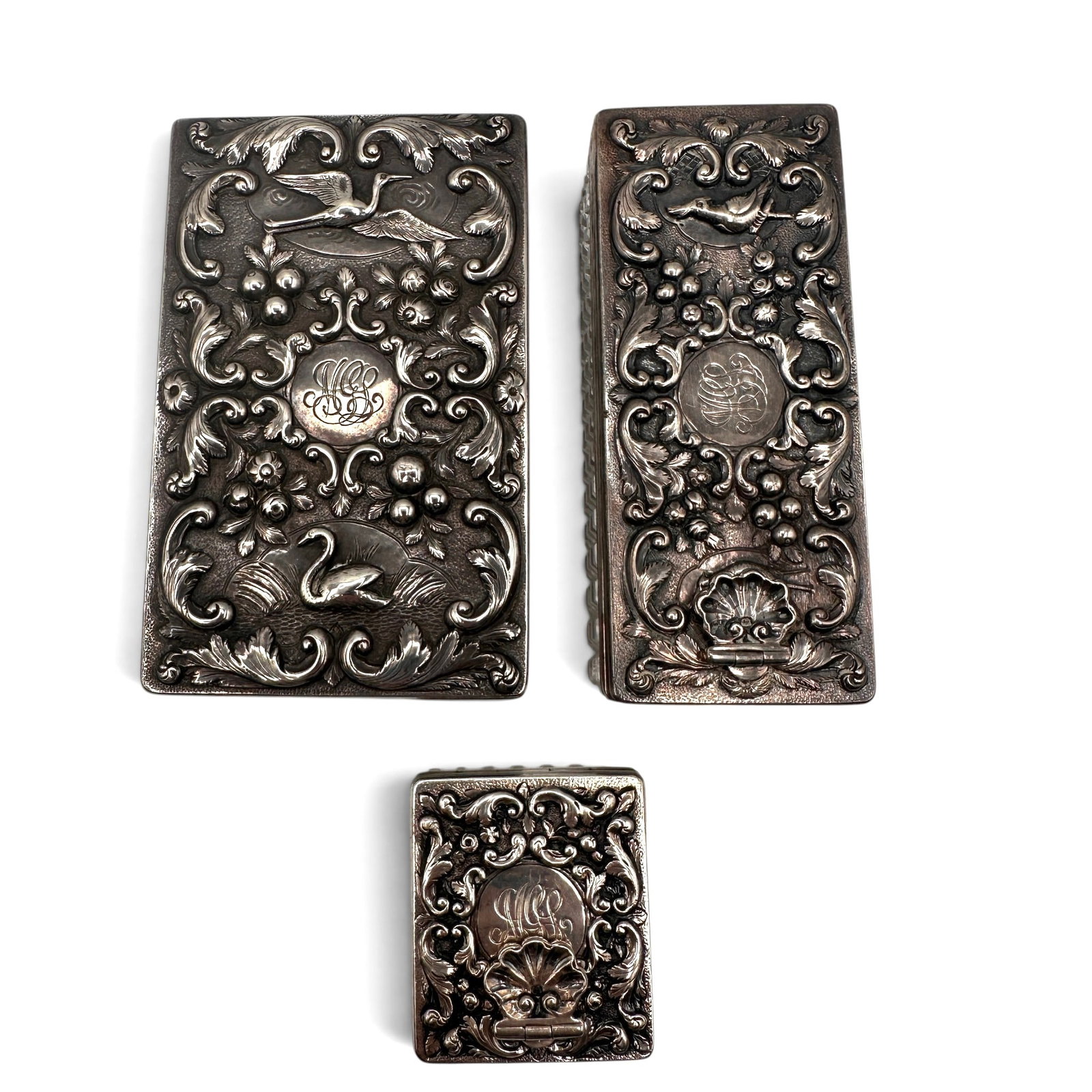 Rare English Sterling Silver and Crystal High Relief Boxes: Largest box measures 4" long x 2 1/2" wide x 1 3/8" tall. Medium box with shell screw closure measures 4" long x 1 5/8" wide x 1 5/8" tall. Small square box with shell screw closure measures 1 1/2" sq