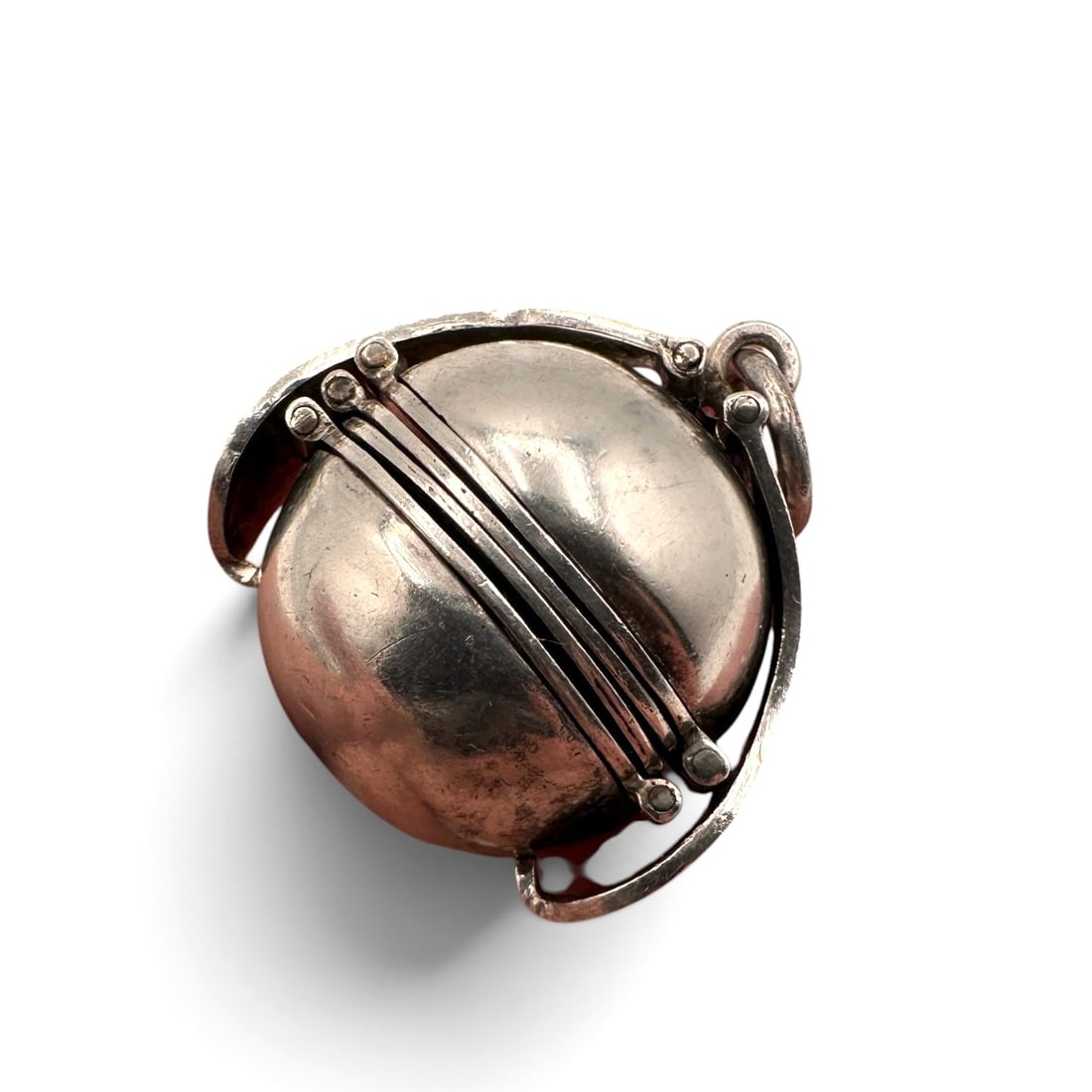 Vintage Sterling Silver Picture Ball Pendant / Locket: Unique vintage sterling silver picture ball pendant, expertly crafted in a spherical form with a hinged opening designed to hold cherished miniature photographs or keepsakes. The polished orb is accen