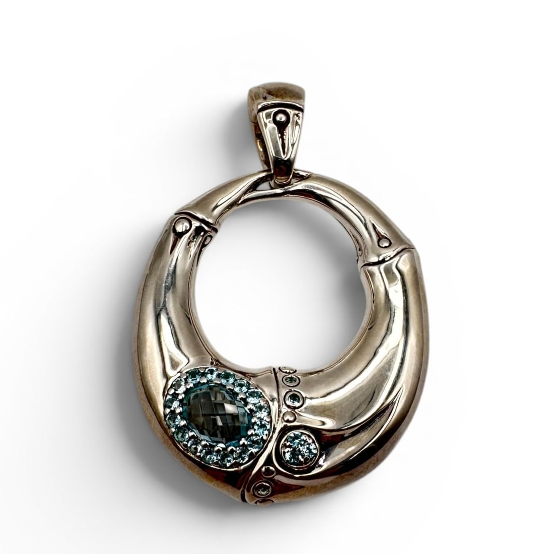 Large John Hardy Bamboo Collection Blue Topaz Pendant: A striking and substantial John Hardy Bamboo Collection pendant, crafted in sterling silver and set with sparkling blue topaz gemstones. This sculptural design features the organic, curved silhouette 