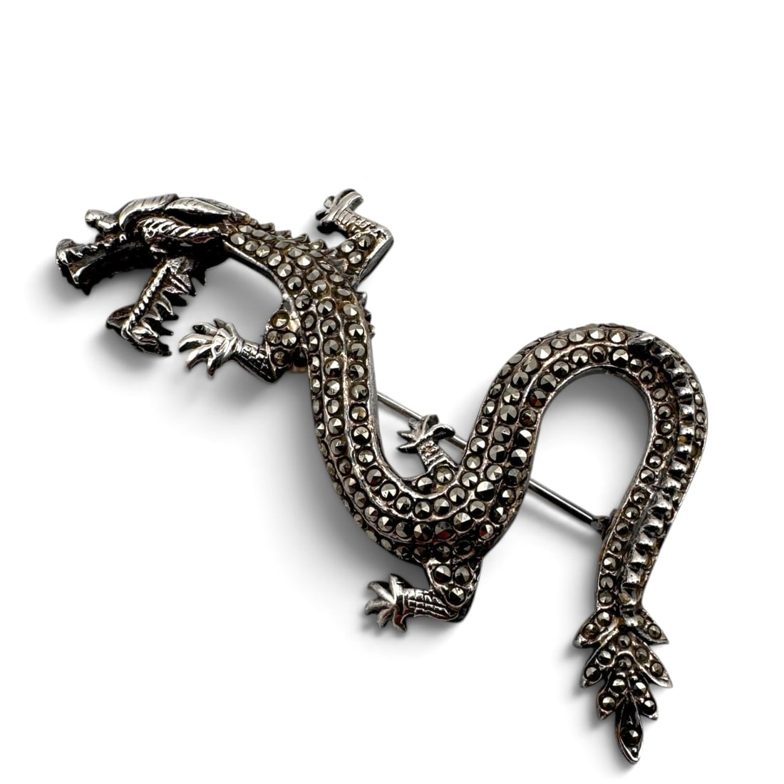 Sterling Silver and Marcasite Dragon Brooch: Measures 2 1/2" in length. Item is being sold as found from an estate collection and may show signs of age, use, wear, imperfections, or surface variations consistent with age and handling. We will no
