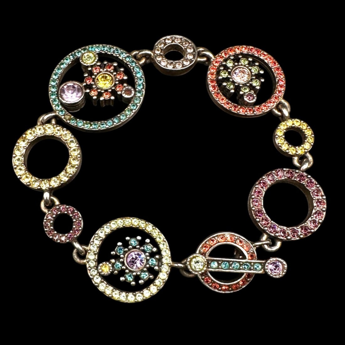 Whimsical Patricia Locke Circles and Stars Bracelet: Measures 7 3/4" long. All Patricia Locke items are signed on the back and are pre-owned in good condition. There may be a small stone missing in some pieces of the collection so please review photos f