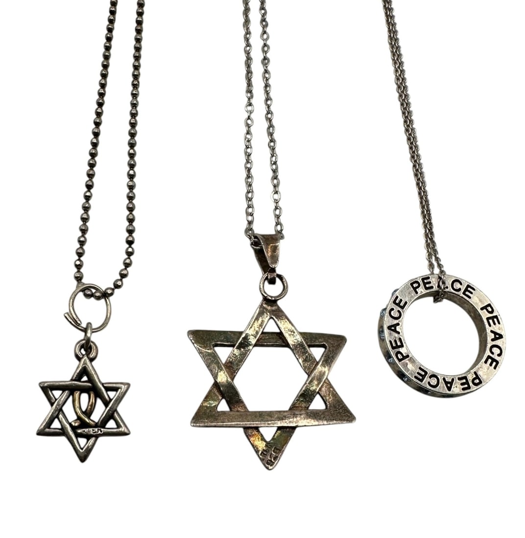 Collection of Sterling Silver Star and Peace Pendants on Silver Chains: Note that two of the chains are not marked sterling and are assumed to be silver-tone metal. Please review photos for more details as they are a part of the description. Item is being sold as found