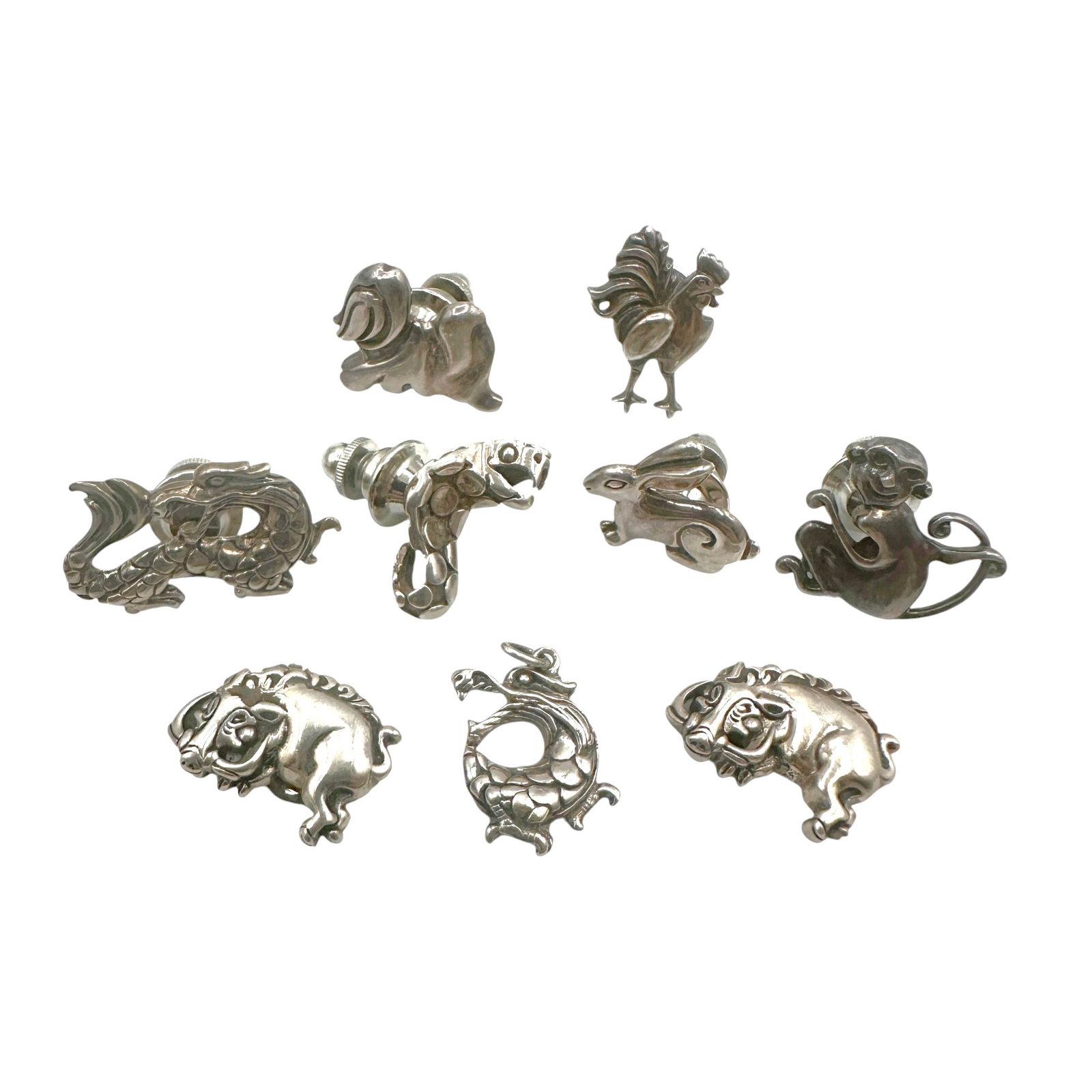 Large Lot of John Hardy Chinese Zodiac Tie Pins in Sterling Silver: Note that several are magnetized and one is missing the magnet. Others are pin, and one is a pendant. Please review photos for more details as they are a part of the description. Item is being sold as