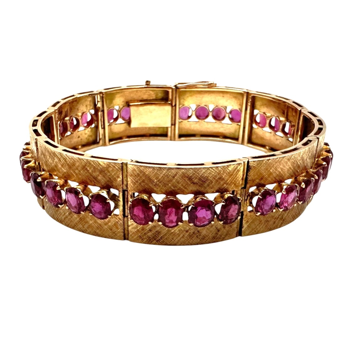 Mid Century 18K Gold and Ruby Statement Bracelet: Total weight 38.2 grams of 18K gold and rubies. Contains 36 rubies. Bracelet measures 7" long, not including the clasp insert. The gold links are decorated with a cross-hatched texture. Please review 