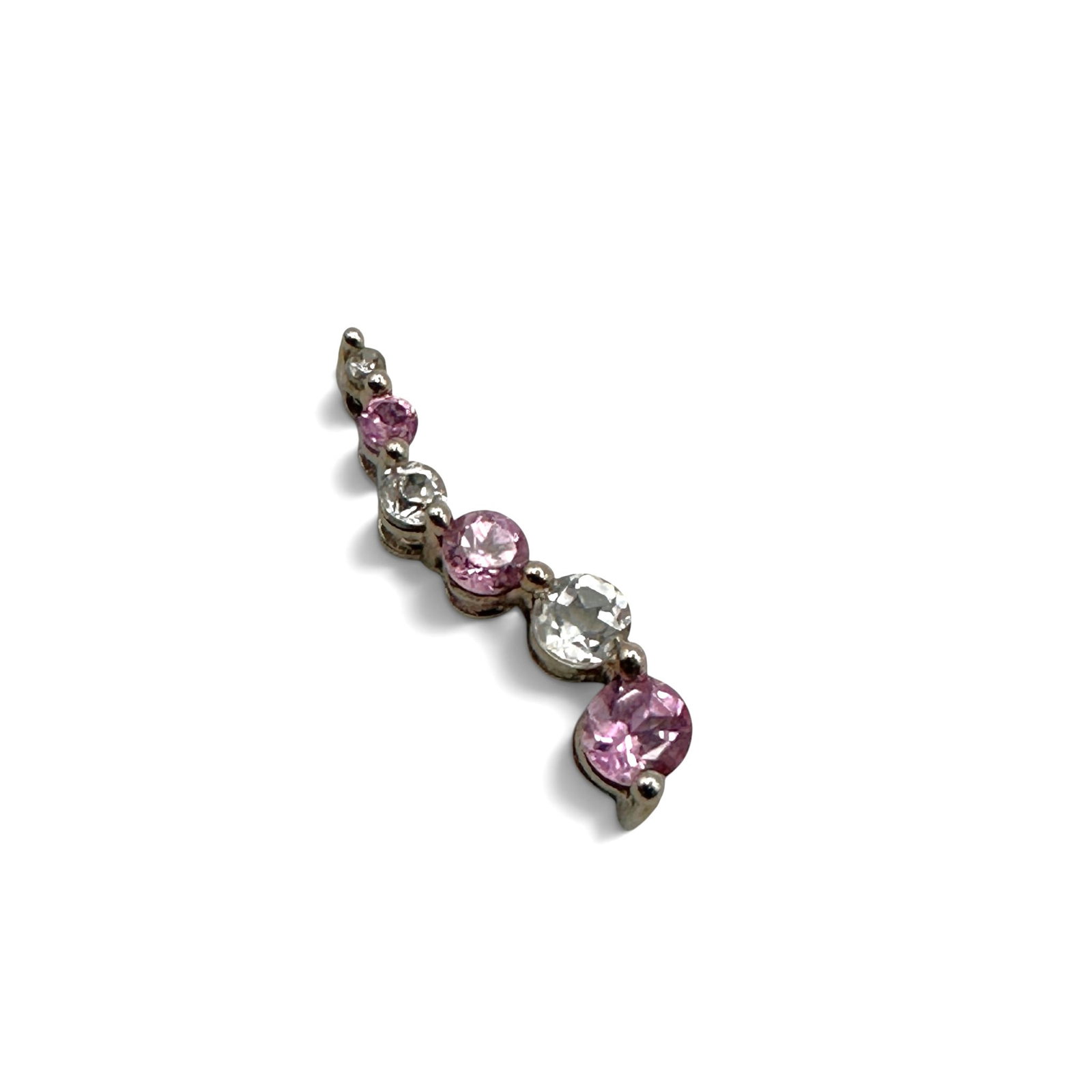 Pink and White Gemstone Curvy 10K White Gold Pendant: Delicate pendant will add sparkle to any chain. Measures 3/4" long and weighs approximately .08 gram. Please review photos for more details as they are a part of the description. Item is being sold