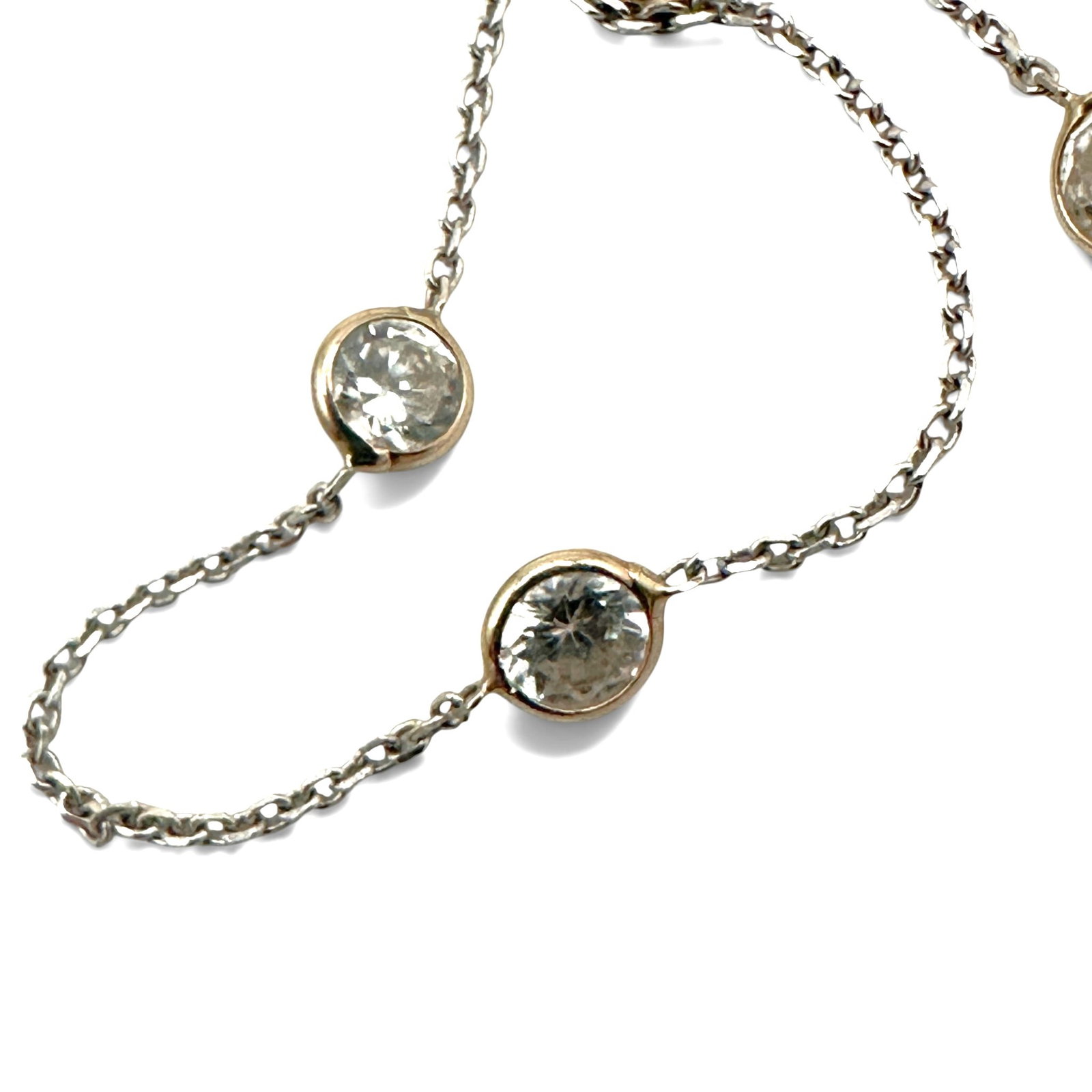 14K White Gold "Diamonds by the Yard" Necklace: Synthetic diamonds necklace measures 16" long and weight 2.6 grams. Please review photos for more details as they are a part of the description. Item is being sold as found from an estate collection